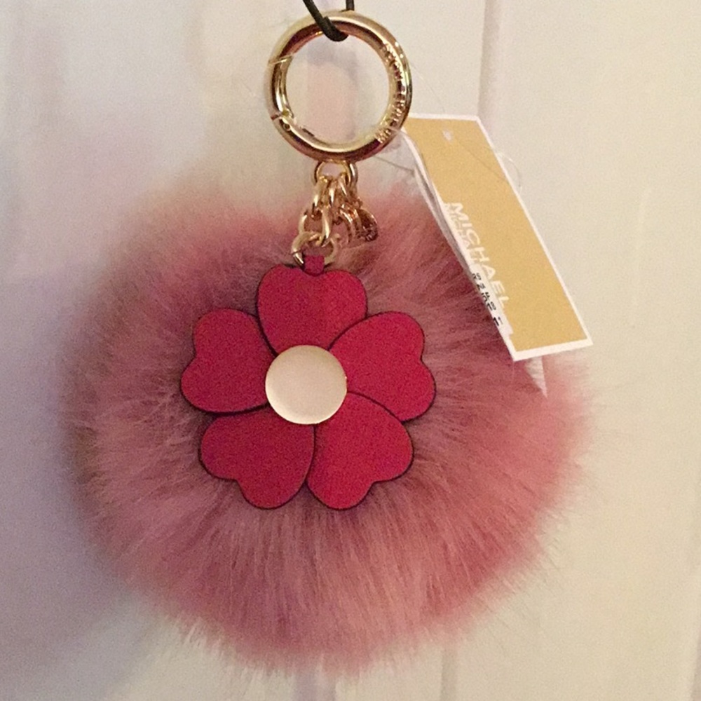 MK’s pink/mauve faux fur puff